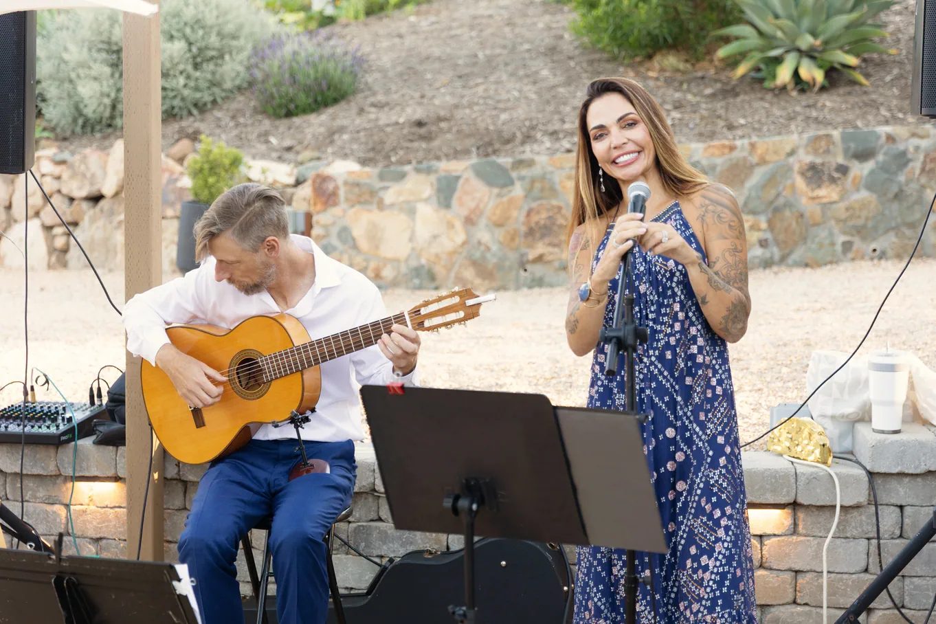 San Diego wedding guitarist Rob Andrew performing with vocalist Sarah at an outdoor ceremony